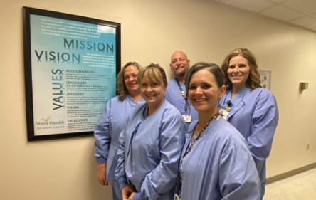 Nurses at Valor Health Hospital in Emmett, Idaho, discussing quality care metrics.